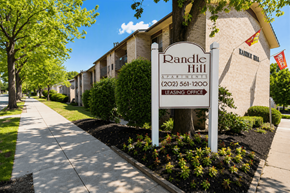 Washington apartment for rent - A sign for Randle Hill Apartments stands in front of apartment buildings.
