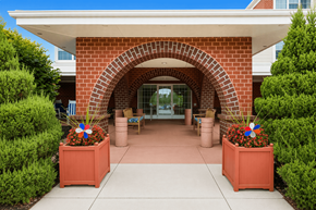 York apartment for rent - A red brick archway leads to a building entrance.