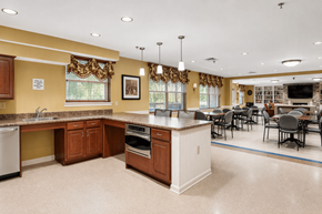Elkridge apartment for rent - A kitchen with brown cabinets and a white island.