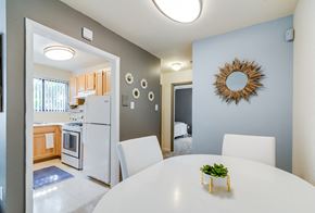 Washington apartment for rent - Bright and inviting dining area inside a Meadowbrook Run apartment home in Congress Heights, D.C., featuring hardwood-style flooring, neutral tones, and ample space for a dining table—perfect for everyday meals or entertaining guests.
