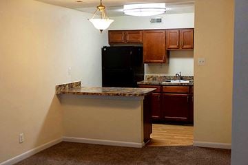Annapolis apartment for rent - a kitchen with a counter top and a black refrigerator
