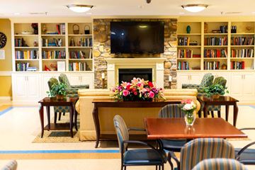Elkridge apartment for rent - a living room with a table and chairs and a fireplace