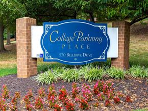 Annapolis apartment for rent - Mid-rise apartment building at College Parkway Place featuring elevator access, controlled entry, off-street parking, and landscaped grounds in the heart of Annapolis, MD.