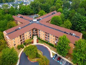 Annapolis apartment for rent - Mid-rise apartment building at College Parkway Place featuring elevator access, controlled entry, off-street parking, and landscaped grounds in the heart of Annapolis, MD.