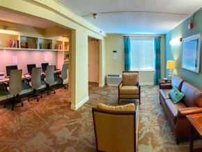 Frederick apartment for rent - a conference room with a table and chairs and a couch