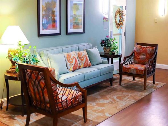 Frederick apartment for rent - a living room with a blue couch and two chairs