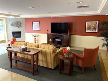 Glen Burnie apartment for rent - a living room with a couch and chairs and a television