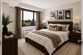 Washington apartment for rent - A well-lit bedroom with a large bed and a view of the outdoors through the window.