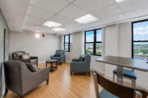 Washington apartment for rent - A room with a table, chairs and a view of the city.