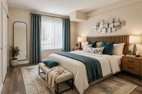 Washington apartment for rent - A bedroom with a large bed, a bench, and a mirror.