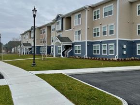 Princess Anne apartment for rent - a row of town houses on a street with a sidewalk