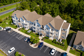 Princess Anne apartment for rent - A large apartment complex with a parking lot in front.