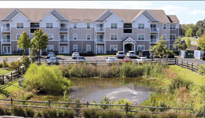 Princess Anne apartment for rent - A large apartment complex with a pond in front.
