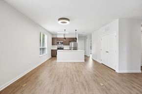 Columbia apartment for rent - A kitchen with white cabinets and a wooden floor.