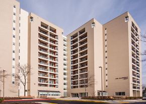 Baltimore apartment for rent - a group of high rise buildings with balconies and a blue sky