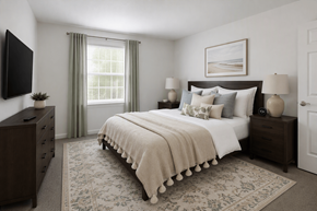 York apartment for rent - A bedroom with a large bed, a dresser, and a window with curtains.