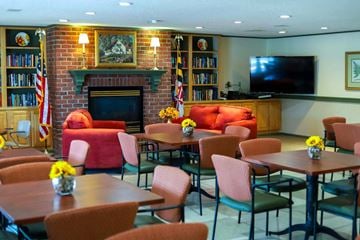 Easton apartment for rent - a living room with tables and chairs and a fireplace
