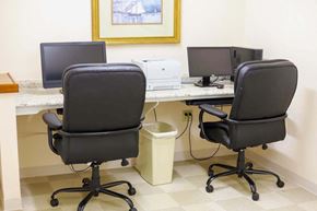 Easton apartment for rent - a computer room with three chairs and two computer monitors