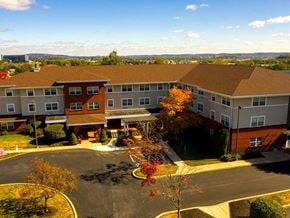 York apartment for rent - an aerial view of a large building in a parking lot