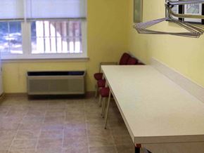 Upper Chichester apartment for rent - a kitchen with a long counter and a window