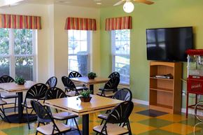 Red Lion apartment for rent - a dining room with tables and chairs and a tv