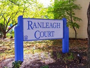 Columbia apartment for rent - A blue sign that says Ranleigh Court stands in front of a tree.