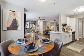 Duluth apartment for rent - Dining room with a round table and 4 chairs at The Hartley at Sweetwater Creek, Duluth, GA, 30096