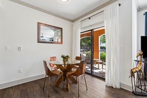 Round Rock apartment for rent - A dining room with a glass table and chairs.