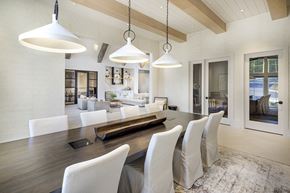 Flowery Branch apartment for rent - A modern dining room with a long table and chairs at Folksong Apartments, Georgia