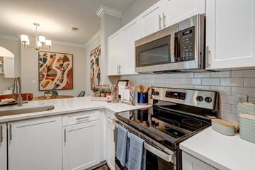 Raleigh apartment for rent - Centerview at Crossroads Kitchen white quartz counters and electric stove