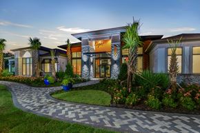 Orlando apartment for rent - a rendering of the front of a building with palm trees