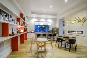Orlando apartment for rent - a dining room with tables and chairs and a fireplace