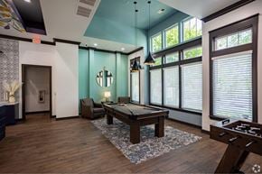 Smyrna apartment for rent - a game room with a pool table and large windows at Grand Oak at Town Park, Smyrna, 37167