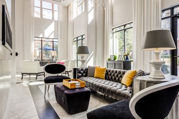 Charlotte apartment for rent - a living room with a couch and chairs and large windows