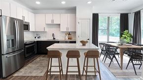 Indian Trail apartment for rent - kitchen island and dining room at Elwood Apartments, Indian Trail, NC