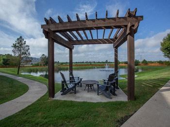 Man made pond with pergola seating