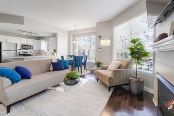 Highlands Ranch apartment for rent - a living room with a couch and a chair in front of a fireplace