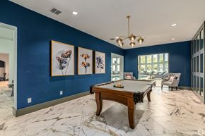 Round Rock townhouse for rent - A pool table in a room with blue walls and marble flooring.