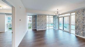 London apartment for rent - A spacious room with wooden floors and large windows.
