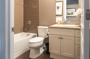 London apartment for rent - a bathroom with a toilet and a tub and a sink