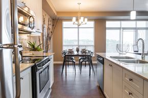 London apartment for rent - a kitchen with a dining table and a large window