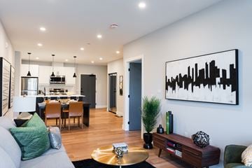London apartment for rent - a living room and dining room with a couch and a table in a house