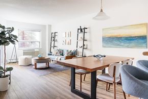 London apartment for rent - a living room with a dining room table and a living
