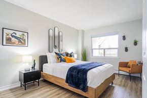 London apartment for rent - a bedroom with a large bed and a window