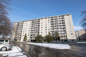 London apartment for rent - a large apartment building on a city street with snow