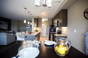 London apartment for rent - a dining room table with lemons in front of a kitchen