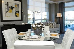 London apartment for rent - a living room with white chairs and a glass table