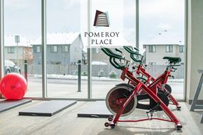 London apartment for rent - a red bike parked in a gym in front of a window