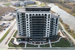 London apartment for rent - an aerial view of a building next to a river