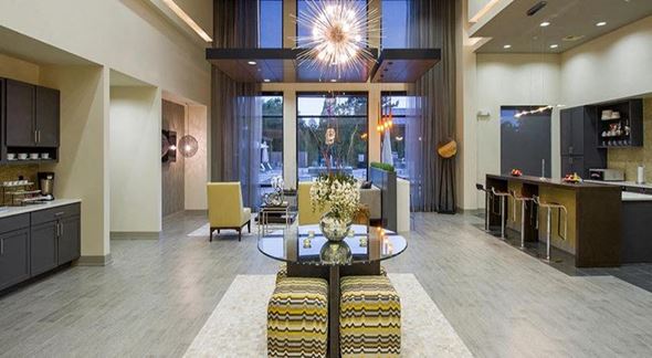 Baton Rouge apartment for rent - a living room with a table and a lobby